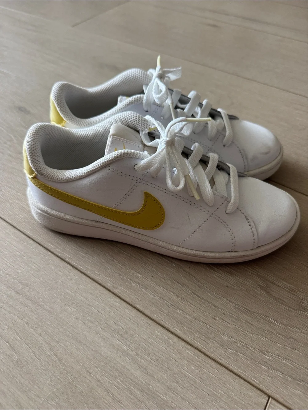 Nike White Sneakers with Yellow Swoosh